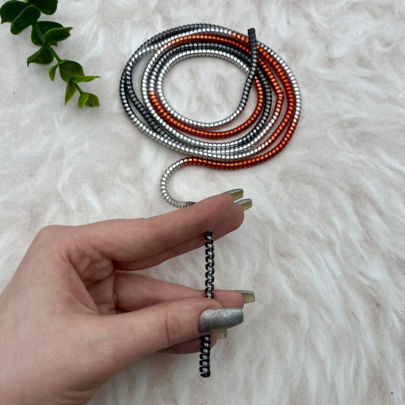 محافظ کابل شارژ و هندزفری لیزری فنری اورجینال یاماتو رنگ طیفی مشکی نقره ای قرمز